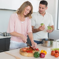 Couple preparing food in kitchen